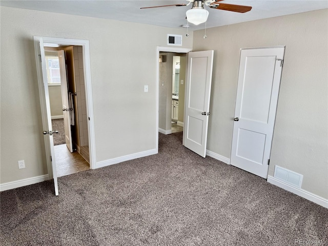 unfurnished bedroom featuring ceiling fan and carpet floors