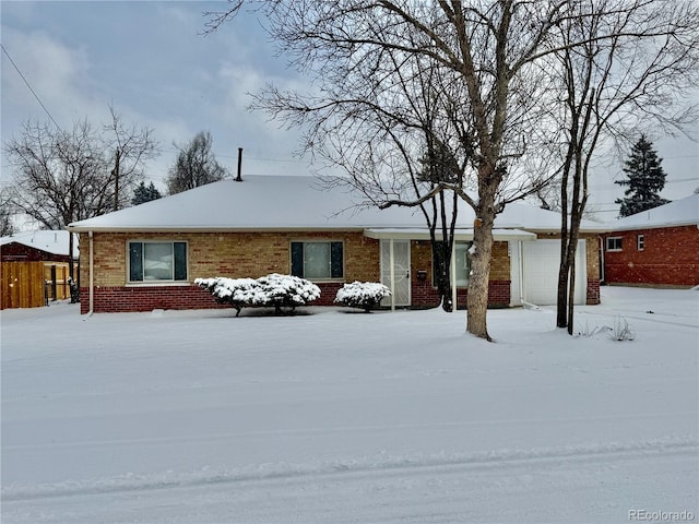 ranch-style home featuring a garage