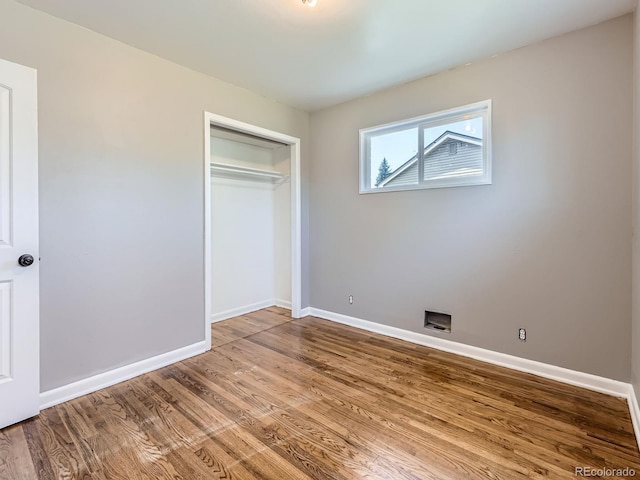 10736 Logan Ct, Northglenn, CO 80233 - unfurnished bedroom featuring wood finished floors and a closet