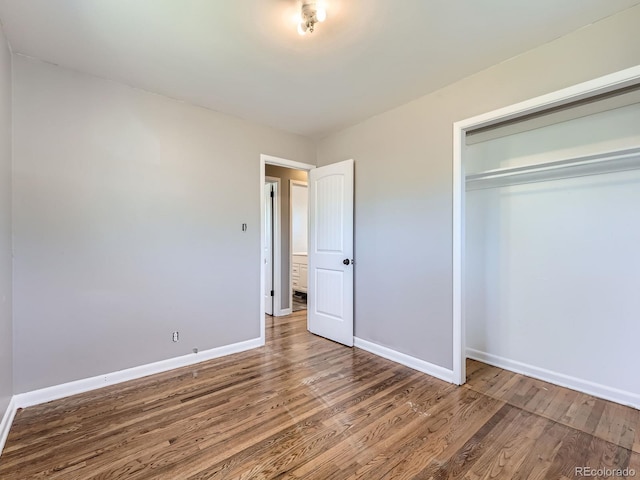 10736 Logan Ct, Northglenn, CO 80233 - unfurnished bedroom with wood finished floors and a closet