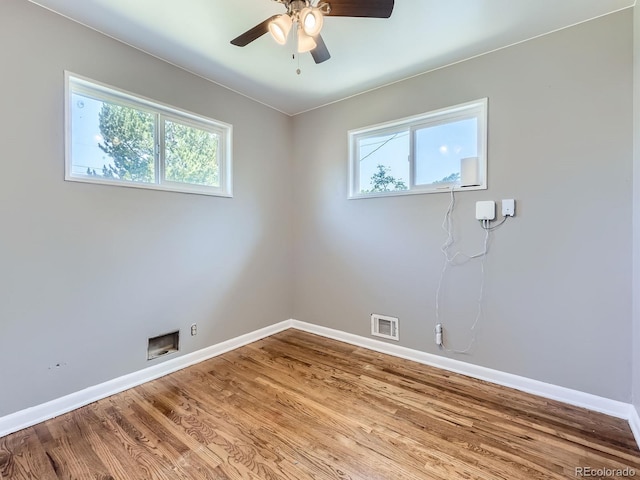 10736 Logan Ct, Northglenn, CO 80233 - unfurnished room featuring plenty of natural light, wood finished floors, and a ceiling fan
