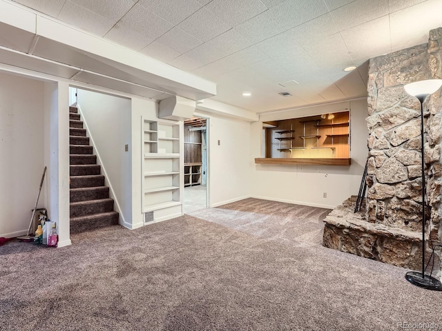 10736 Logan Ct, Northglenn, CO 80233 - unfurnished living room featuring carpet flooring and stairs