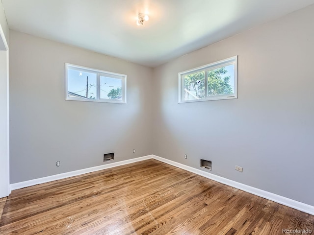 10736 Logan Ct, Northglenn, CO 80233 - spare room with baseboards and wood finished floors