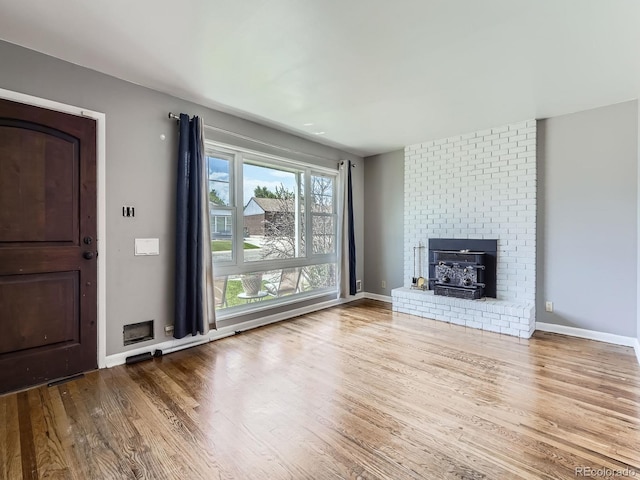 10736 Logan Ct, Northglenn, CO 80233 - unfurnished living room with wood finished floors and baseboards
