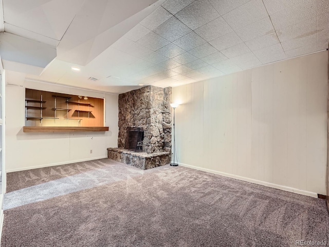 10736 Logan Ct, Northglenn, CO 80233 - unfurnished living room with carpet flooring and a fireplace