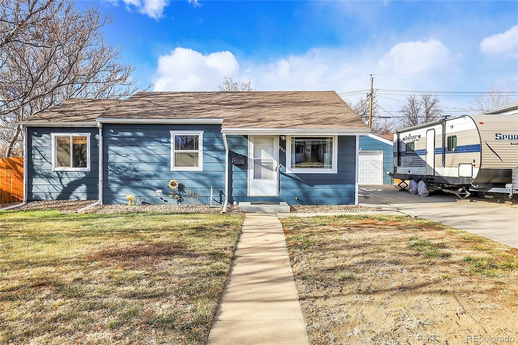 bungalow-style house with a front lawn