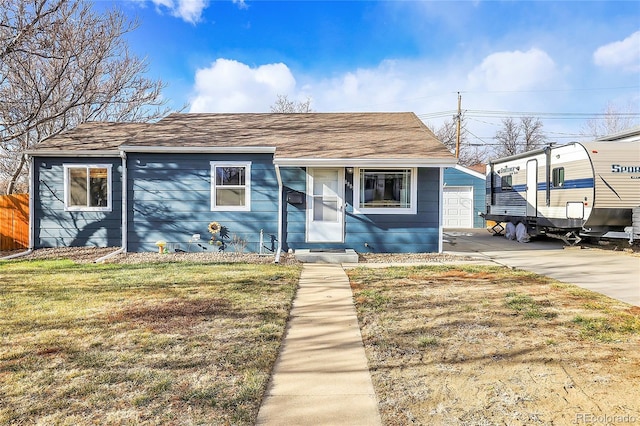 bungalow-style house with a front lawn