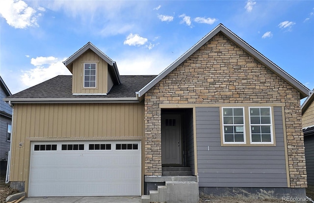17075 W 92nd Loop, Arvada, CO 80007 - view of front facade featuring stone siding, a garage, driveway, and entry steps