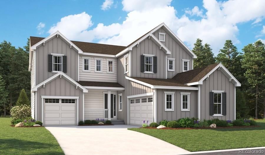 view of front of property featuring a garage and a front yard