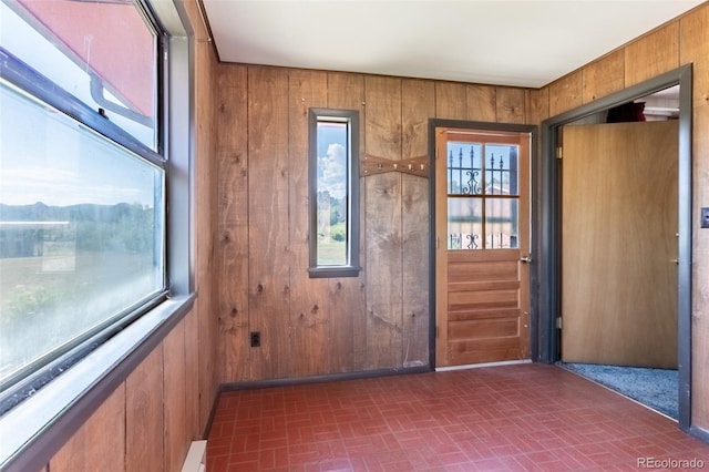 13705 County Road 45, Coaldale, CO 81222 - foyer with wooden walls and brick patterned floors