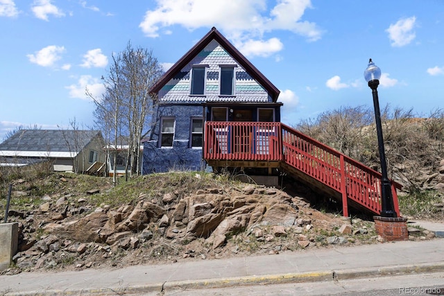 view of front of house with a wooden deck