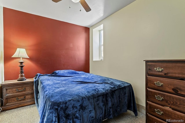 bedroom with light colored carpet, ceiling fan, and vaulted ceiling