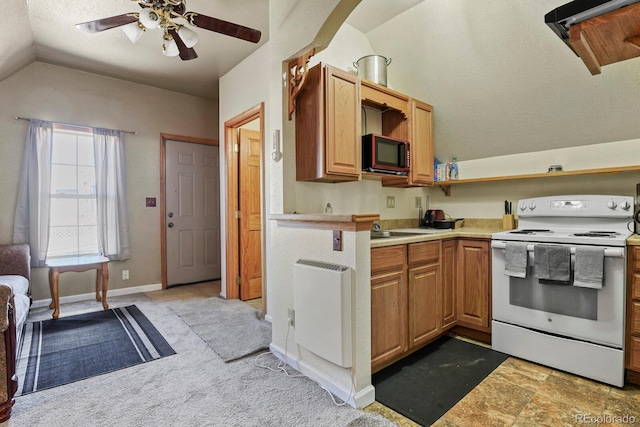 kitchen with electric range, ceiling fan, light tile floors, and lofted ceiling