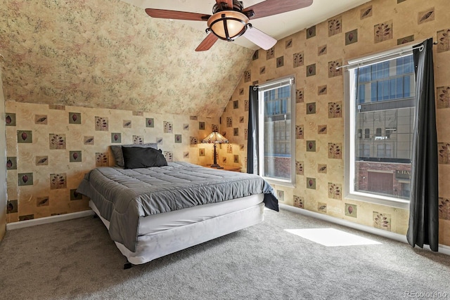 carpeted bedroom featuring lofted ceiling and ceiling fan