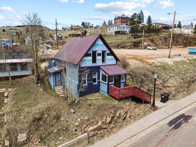 view of front of home featuring a wooden deck