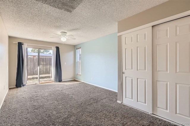 unfurnished bedroom featuring access to exterior, a ceiling fan, carpet flooring, a textured ceiling, and baseboards