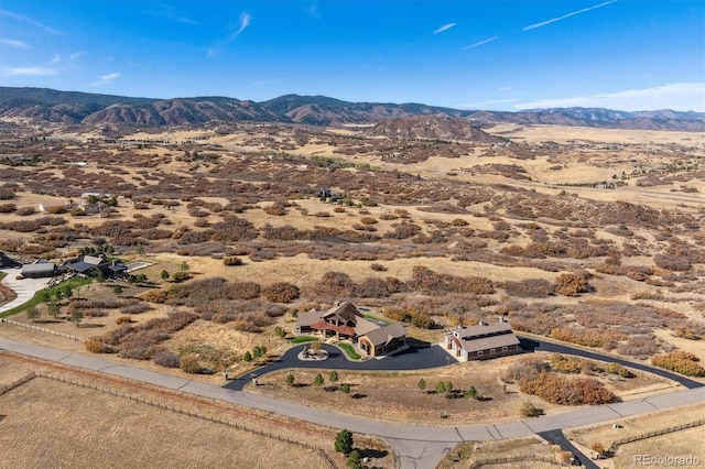 birds eye view of property featuring a mountain view