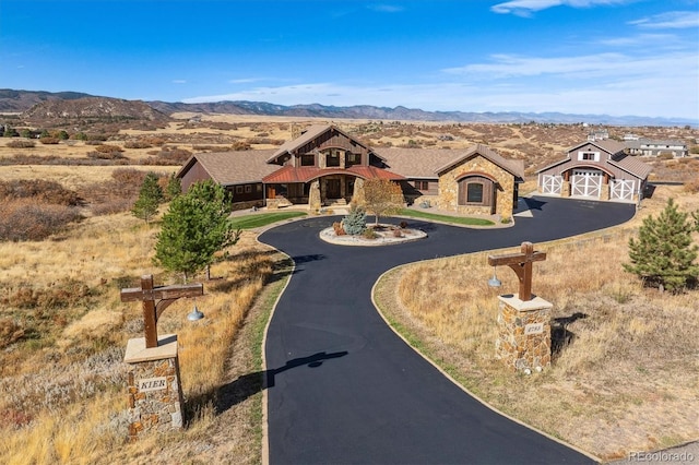 view of front of home featuring a mountain view