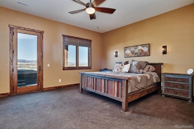 bedroom with ceiling fan, dark colored carpet, and access to outside