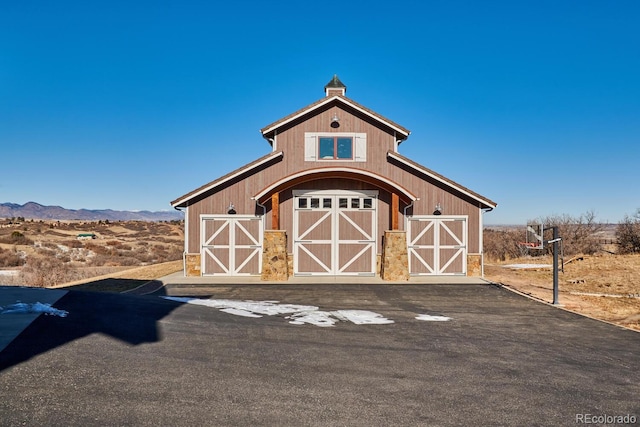 view of outbuilding with a mountain view