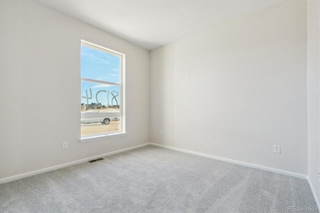 spare room with carpet floors