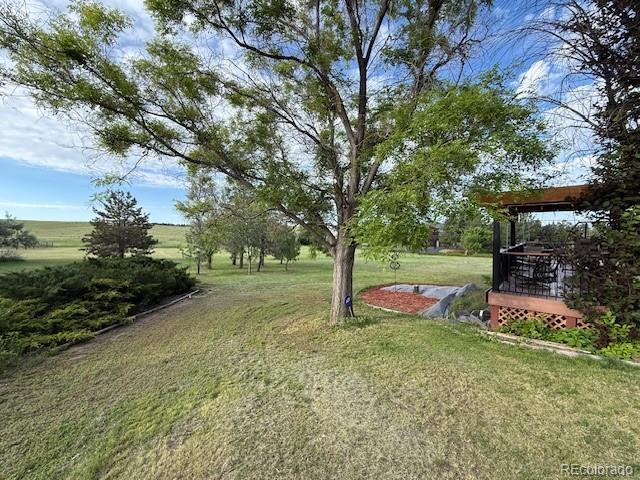 17852 E Long Ave, Centennial, CO 80016 - view of grassy yard with a deck