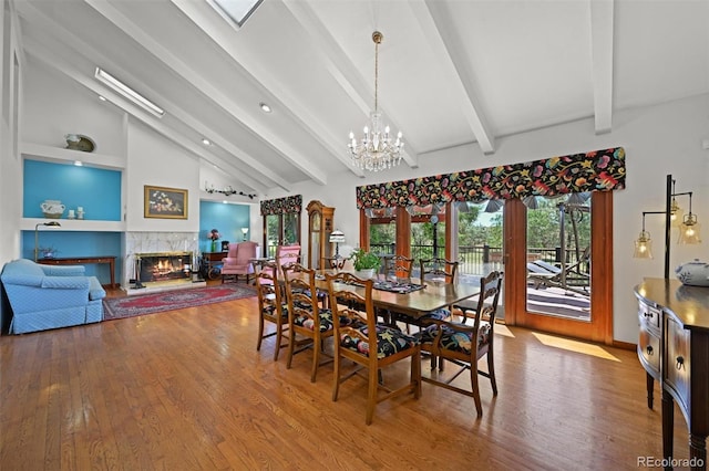 17852 E Long Ave, Centennial, CO 80016 - dining room with wood finished floors, a chandelier, and plenty of natural light