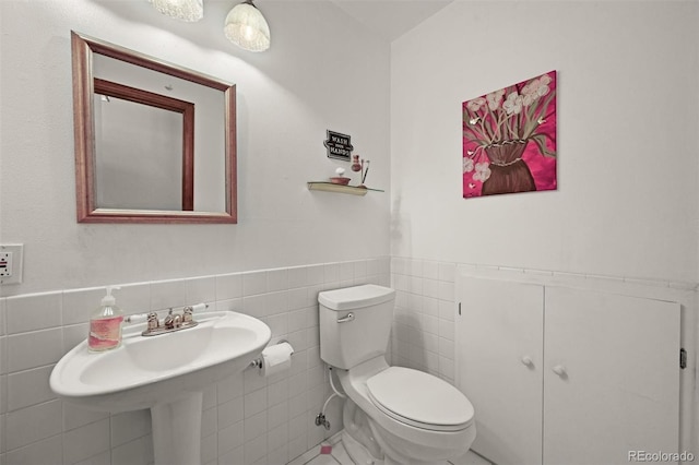 17852 E Long Ave, Centennial, CO 80016 - bathroom featuring tile walls and wainscoting