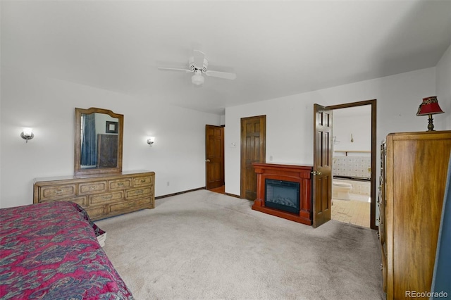 17852 E Long Ave, Centennial, CO 80016 - unfurnished bedroom with carpet, a glass covered fireplace, connected bathroom, and a ceiling fan