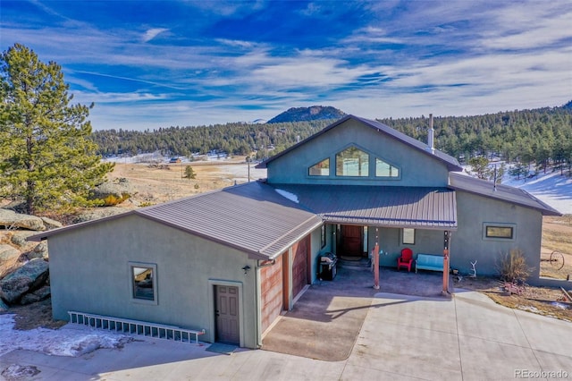 view of front of home featuring a mountain view and a garage