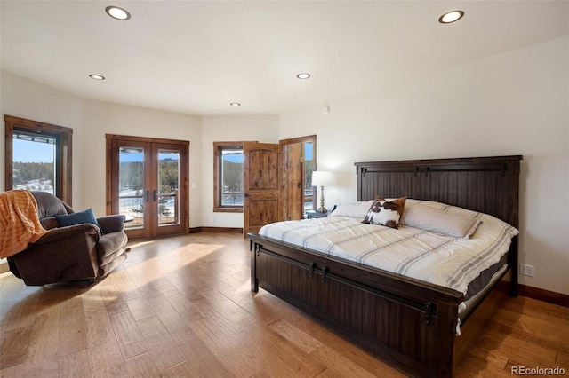 bedroom with access to outside, french doors, and light hardwood / wood-style floors