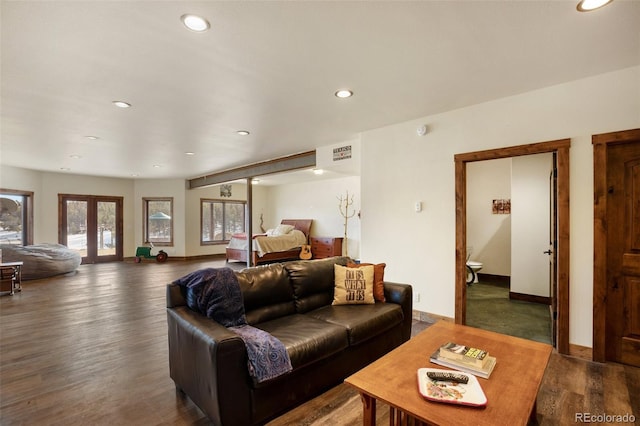 living room with dark hardwood / wood-style floors and french doors