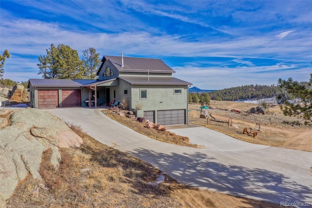 view of front of house with a mountain view and a garage