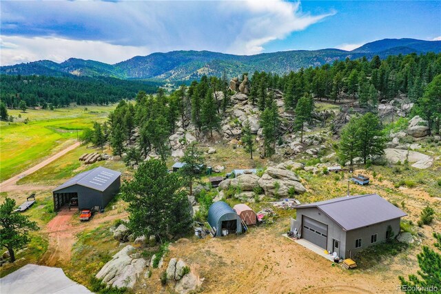 birds eye view of property with a mountain view