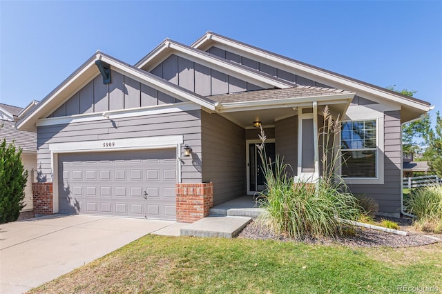 view of front of home featuring a garage and a front lawn