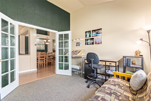 home office with french doors, high vaulted ceiling, and hardwood / wood-style floors