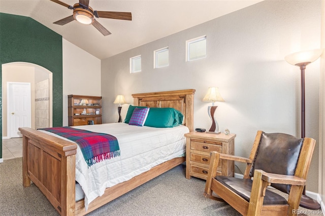 carpeted bedroom featuring high vaulted ceiling and ceiling fan