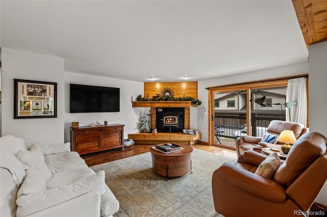 1655 Ranch Rd Unit 403, Steamboat Springs, CO 80487 - living area featuring a lit fireplace and wood finished floors