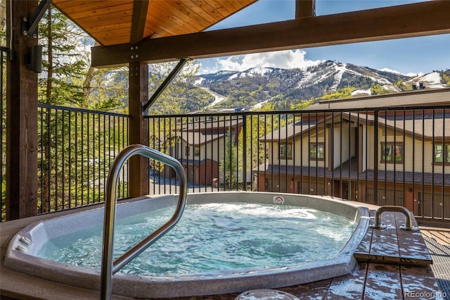 1655 Ranch Rd Unit 403, Steamboat Springs, CO 80487 - view of swimming pool with an outdoor hot tub and a mountain view