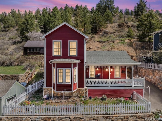 151 Marchant St, Black Hawk, CO 80422 - view of front facade featuring covered porch, stone siding, and stairs