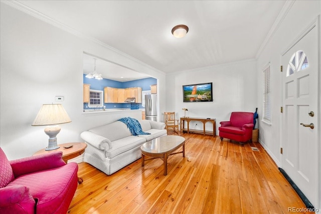 151 Marchant St, Black Hawk, CO 80422 - living area featuring light wood-style flooring and crown molding