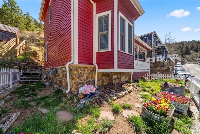 151 Marchant St, Black Hawk, CO 80422 - view of home's exterior with stone siding and fence