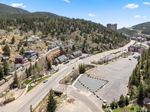 151 Marchant St, Black Hawk, CO 80422 - aerial view of property and surrounding area featuring a mountain backdrop and a heavily wooded area