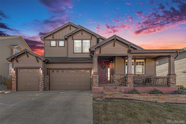 craftsman inspired home with covered porch and a garage