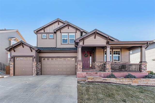 craftsman inspired home with covered porch and a garage