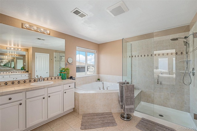 bathroom featuring tile patterned floors, vanity, independent shower and bath, and tasteful backsplash