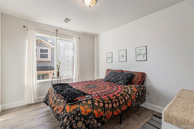 bedroom featuring light wood-type flooring