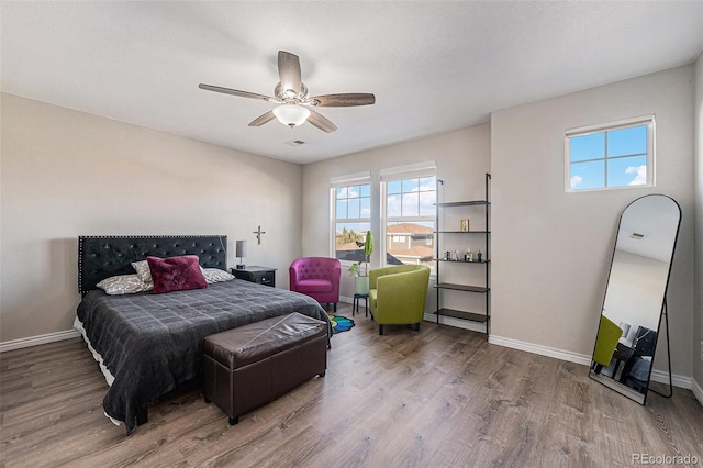 bedroom featuring hardwood / wood-style flooring and ceiling fan