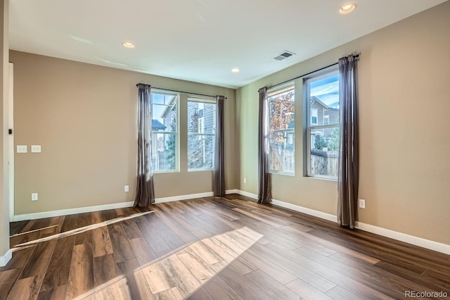 spare room with hardwood / wood-style flooring