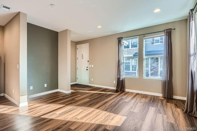 unfurnished room featuring wood-type flooring